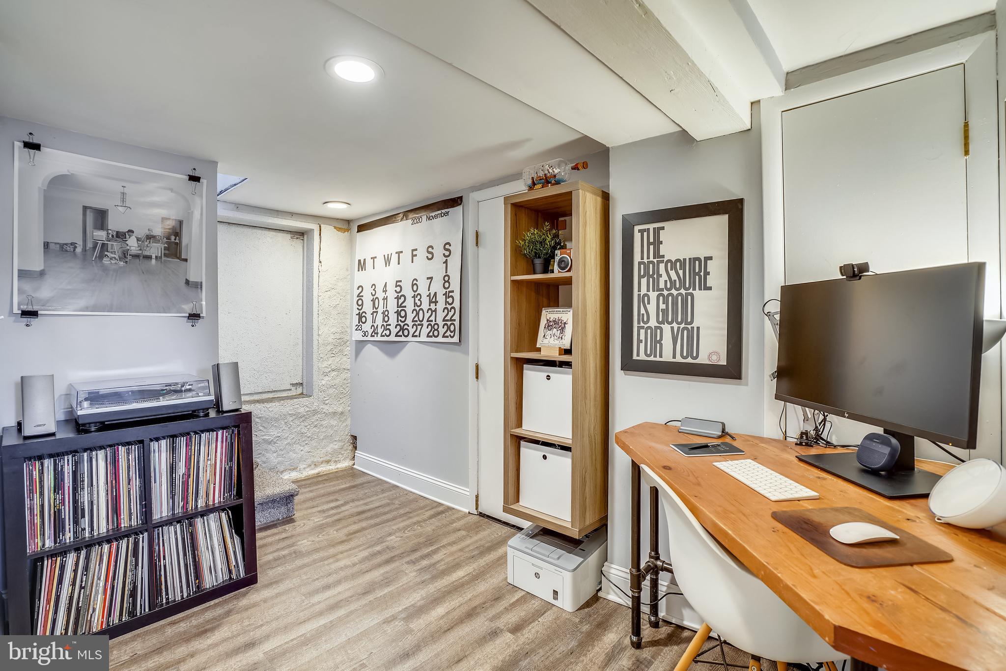 910 Overbrook Road Baltimore, MD 21239 - Photo 29 of 50 a view of a workspace with furniture and wooden floor