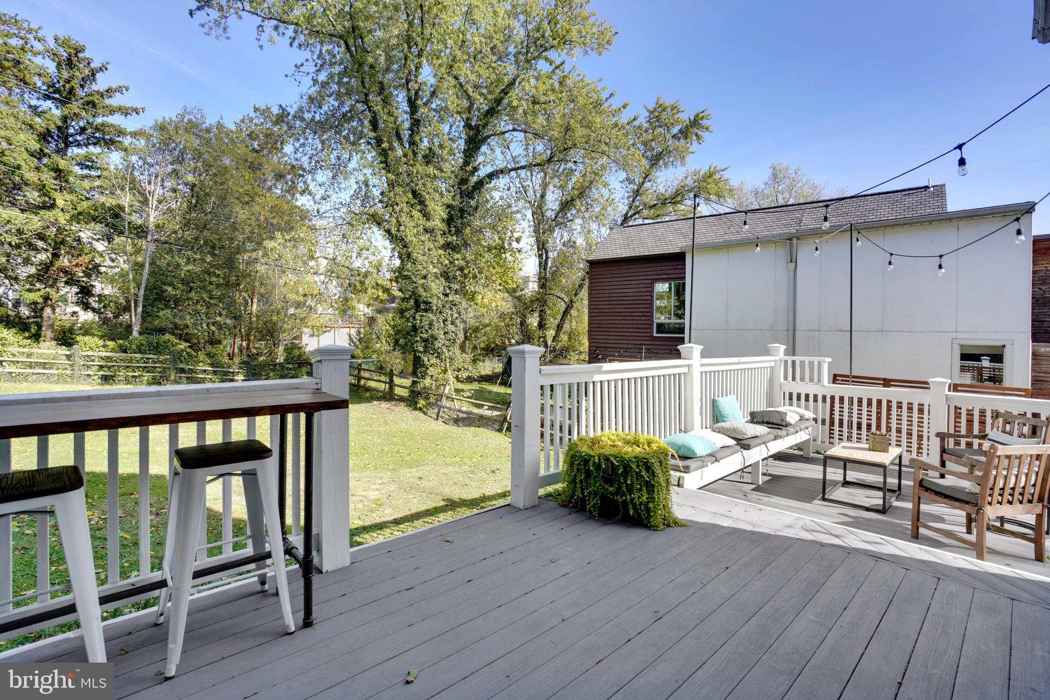 910 Overbrook Road Baltimore, MD 21239 - Photo 35 of 50 a view of a deck with two chair and wooden floor