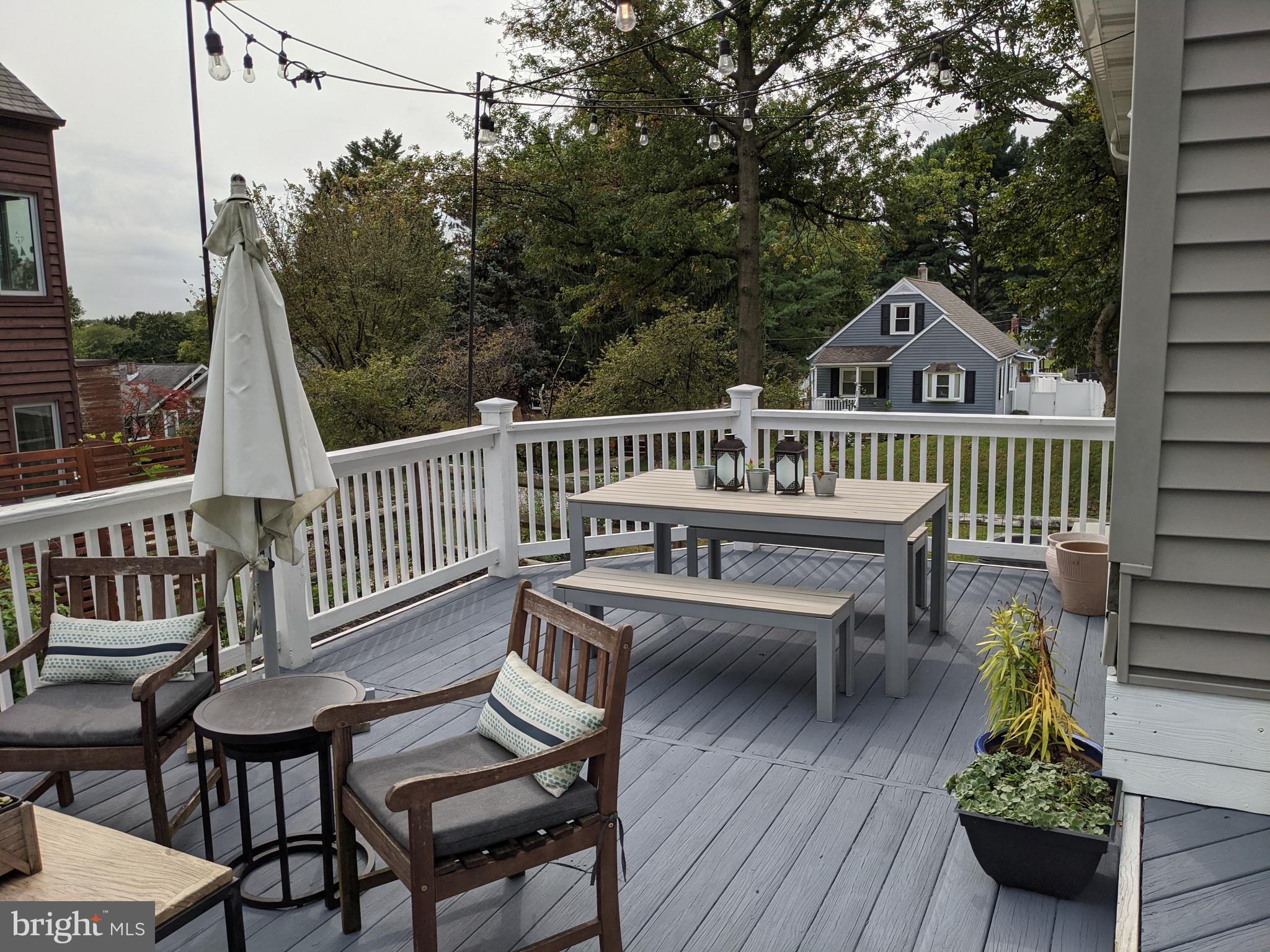 910 Overbrook Road Baltimore, MD 21239 - Photo 47 of 50 a view of a chairs and table on the deck