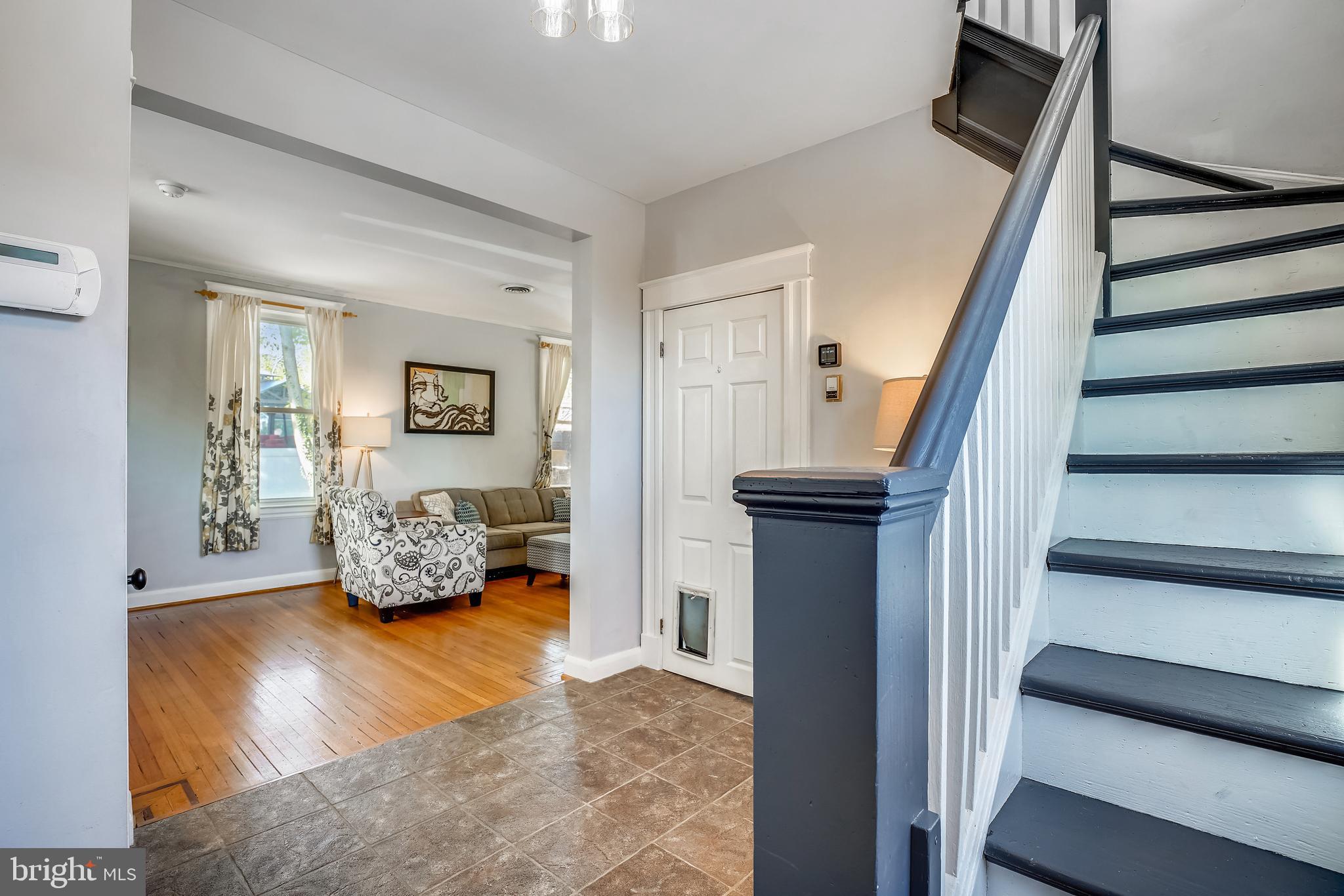 910 Overbrook Road Baltimore, MD 21239 - Photo 10 of 50 a living room with furniture and a wooden floor