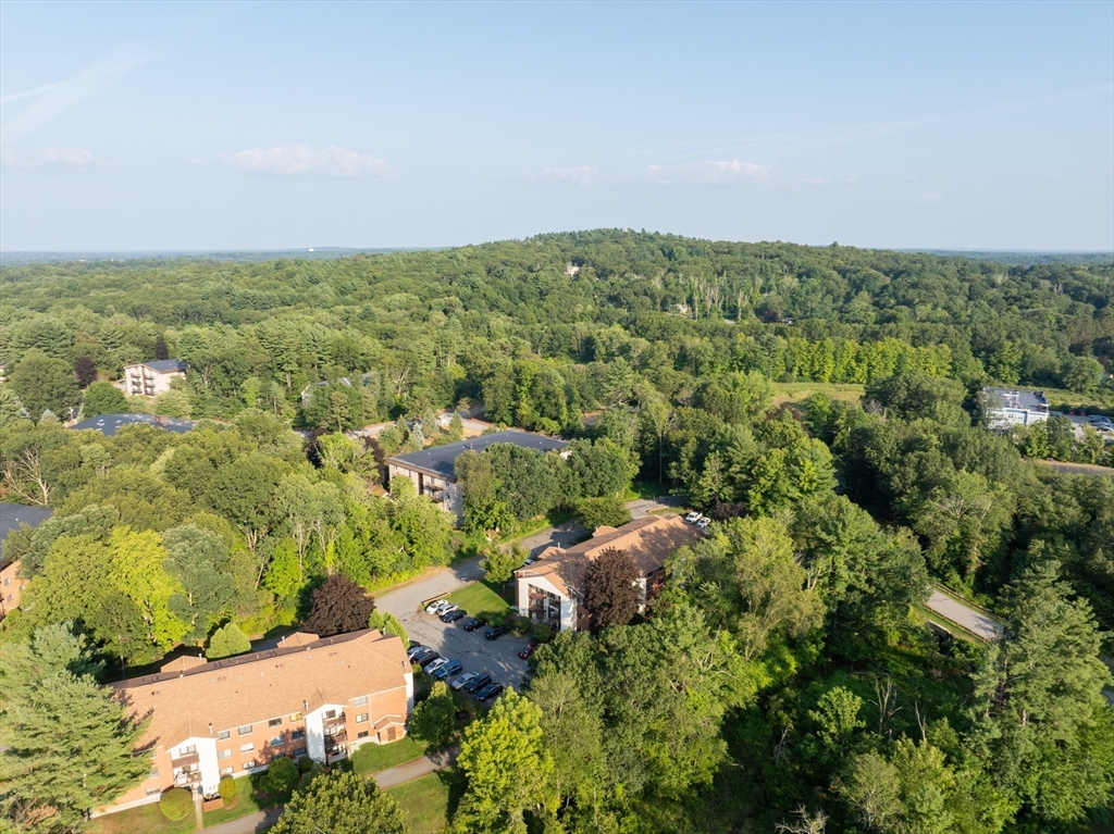 189 Littleton Road, Unit 10 Chelmsford, MA 01824 - Photo 13 of 15 an aerial view of residential houses with outdoor space and trees
