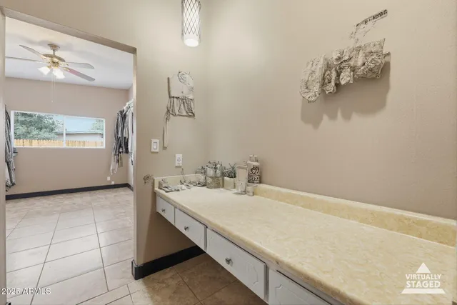 a bathroom with a sink vanity and mirror