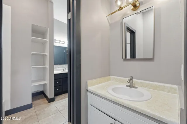 a bathroom with a sink and a mirror