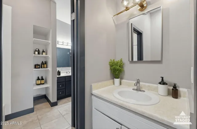a bathroom with a sink and a mirror