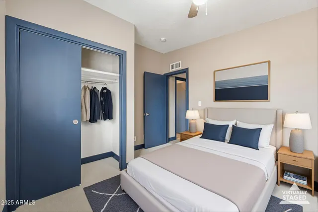 a bedroom with a bed and a lamp