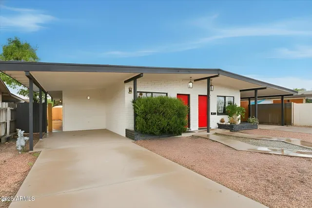 a view of a house with basketball court
