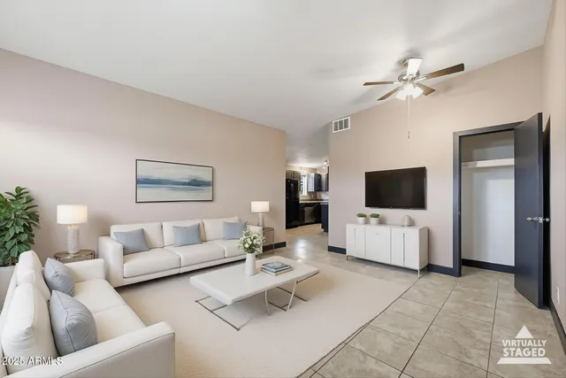 a living room with furniture and a flat screen tv