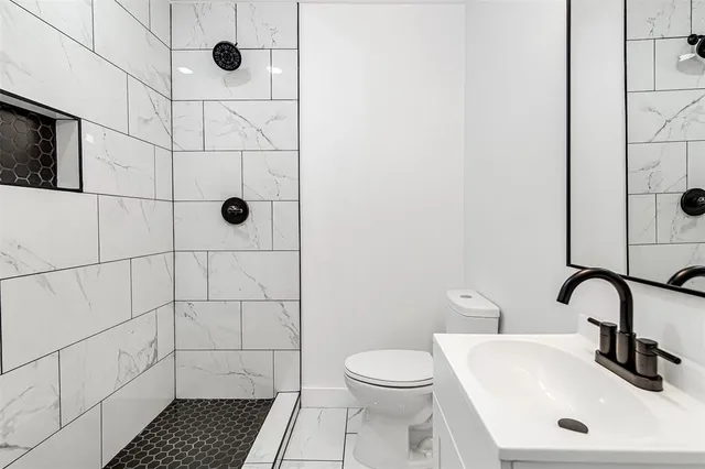 a bedroom with a bed furniture and a window