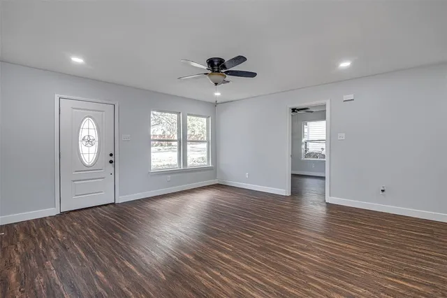 a view of a kitchen with wooden floor and a sink