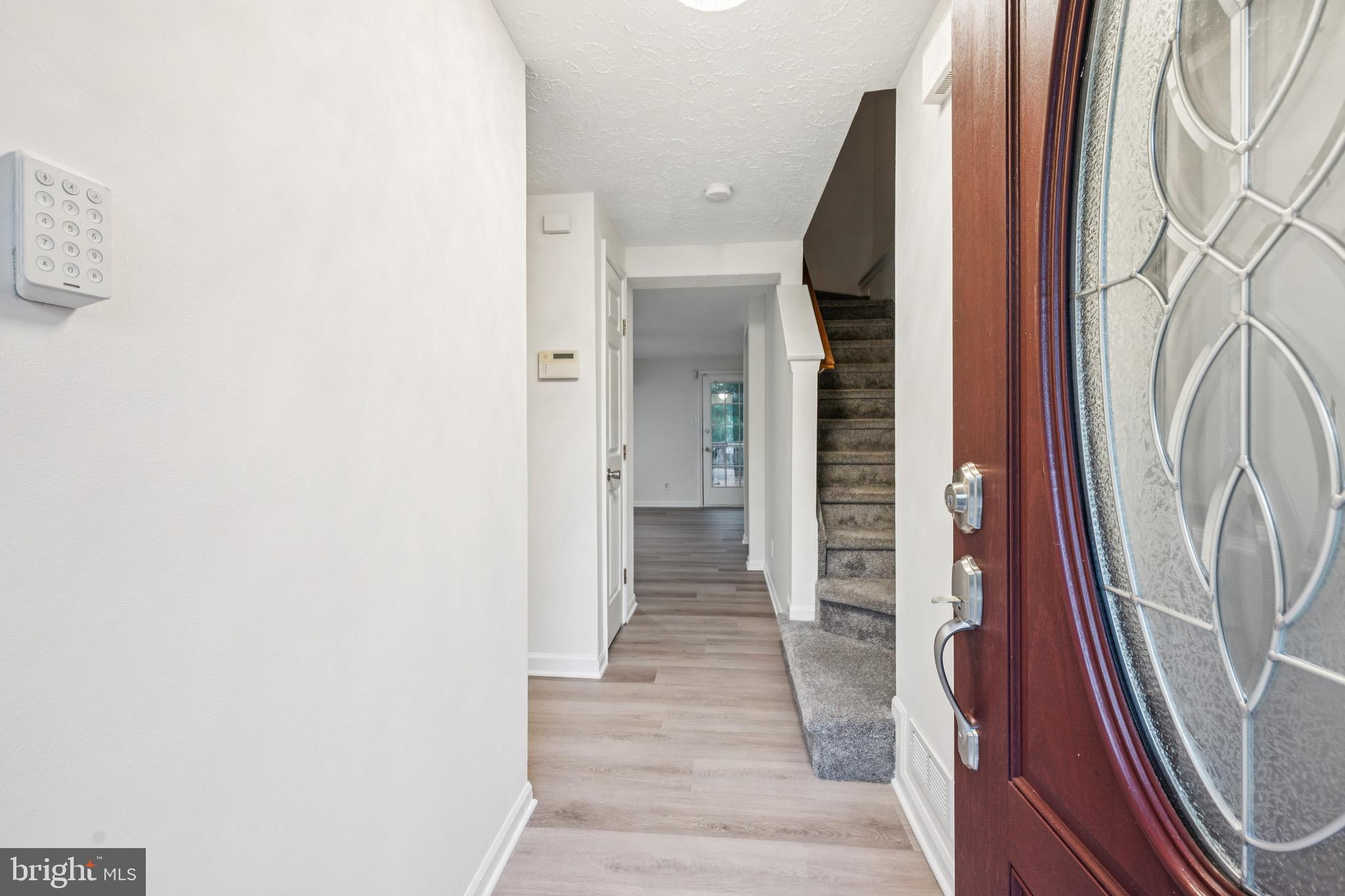 29 Wagon Wheel Drive Sicklerville, NJ 08081 - Photo 2 of 18 a view of a hallway with wooden floor and stairs