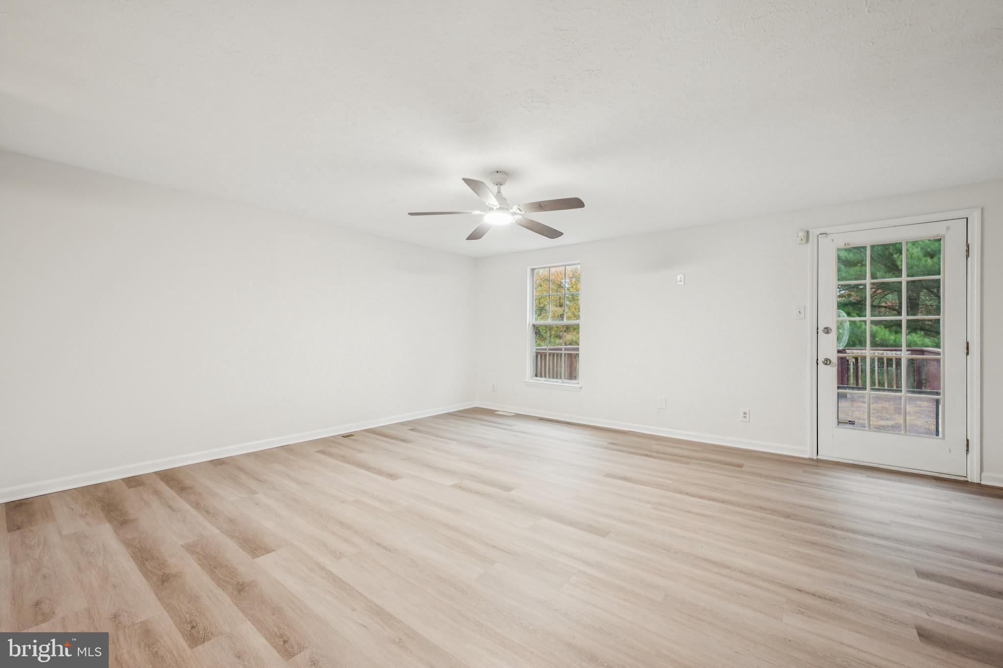 29 Wagon Wheel Drive Sicklerville, NJ 08081 - Photo 5 of 18 wooden floor in an empty room with a window