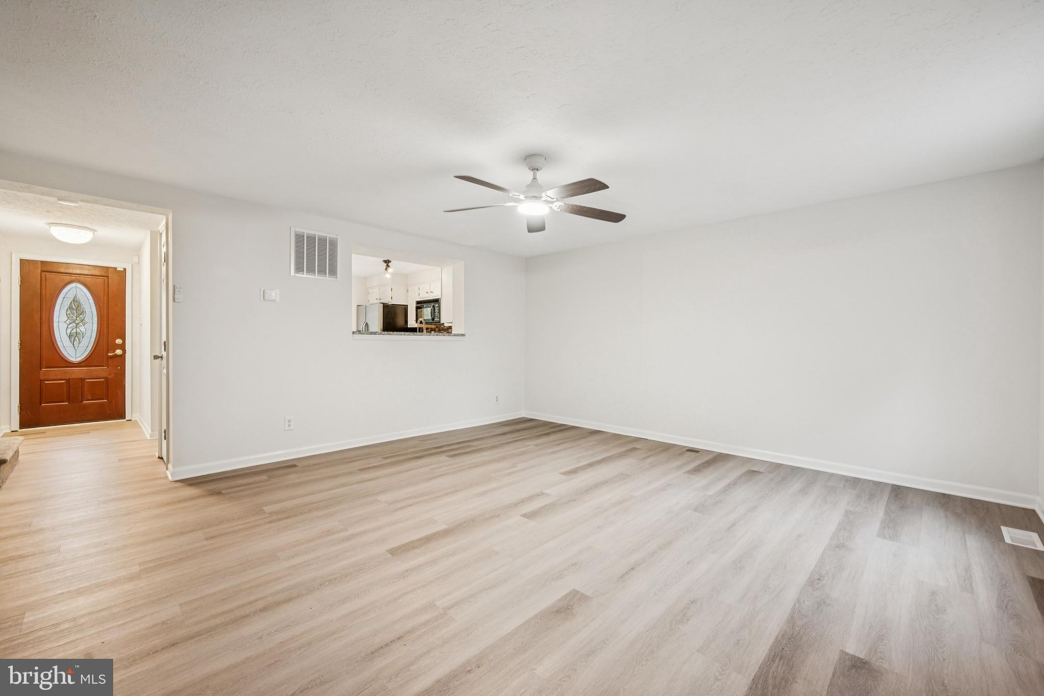 29 Wagon Wheel Drive Sicklerville, NJ 08081 - Photo 8 of 18 an empty room with wooden floor and a ceiling fan