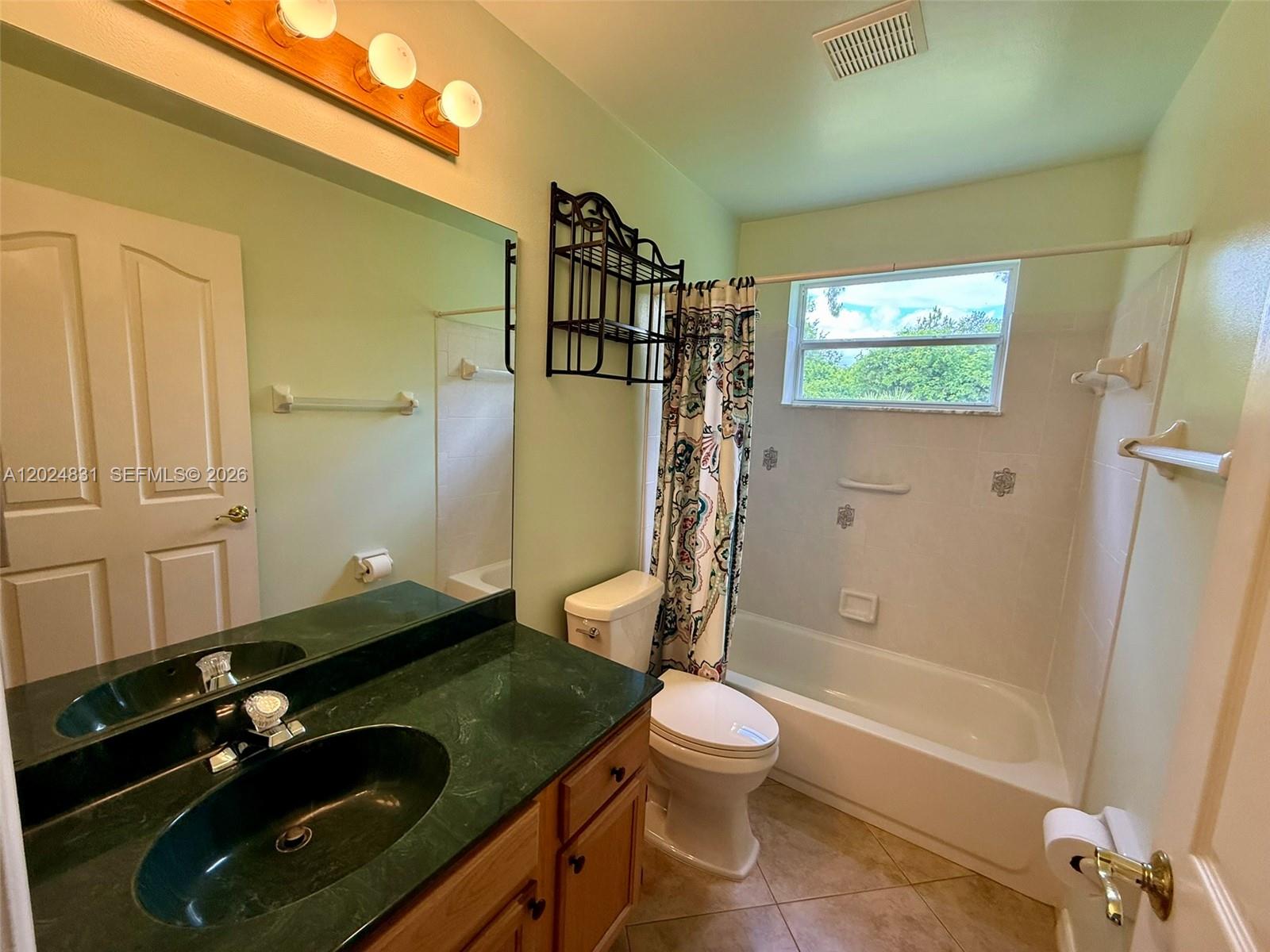 15819 76th Road North Loxahatchee, FL 33470 - Photo 44 of 45 a bathroom with a sink a toilet and shower