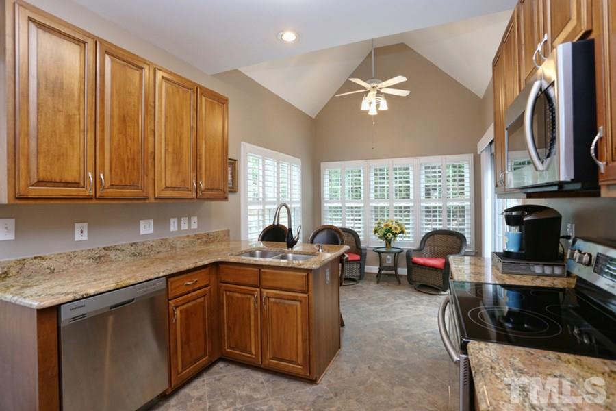 5900 Canewood Place Raleigh, NC 27612 - Photo 8 of 20 Newer kitchen with granite and custom cabinets and stainless steel appliances!