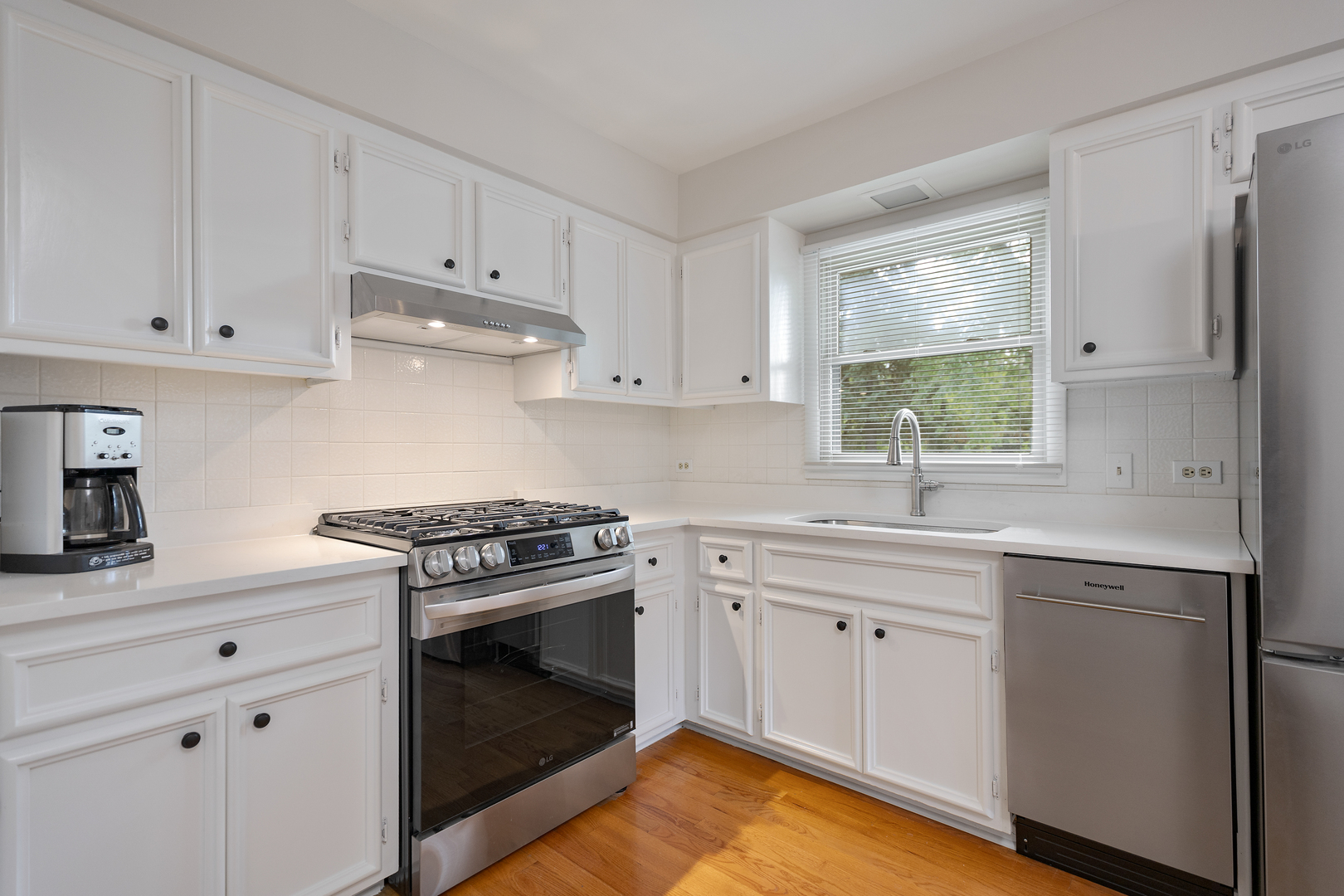 1827 West Sherry Lane Addison, IL 60101 - Photo 13 of 31 a kitchen with cabinets appliances and a window