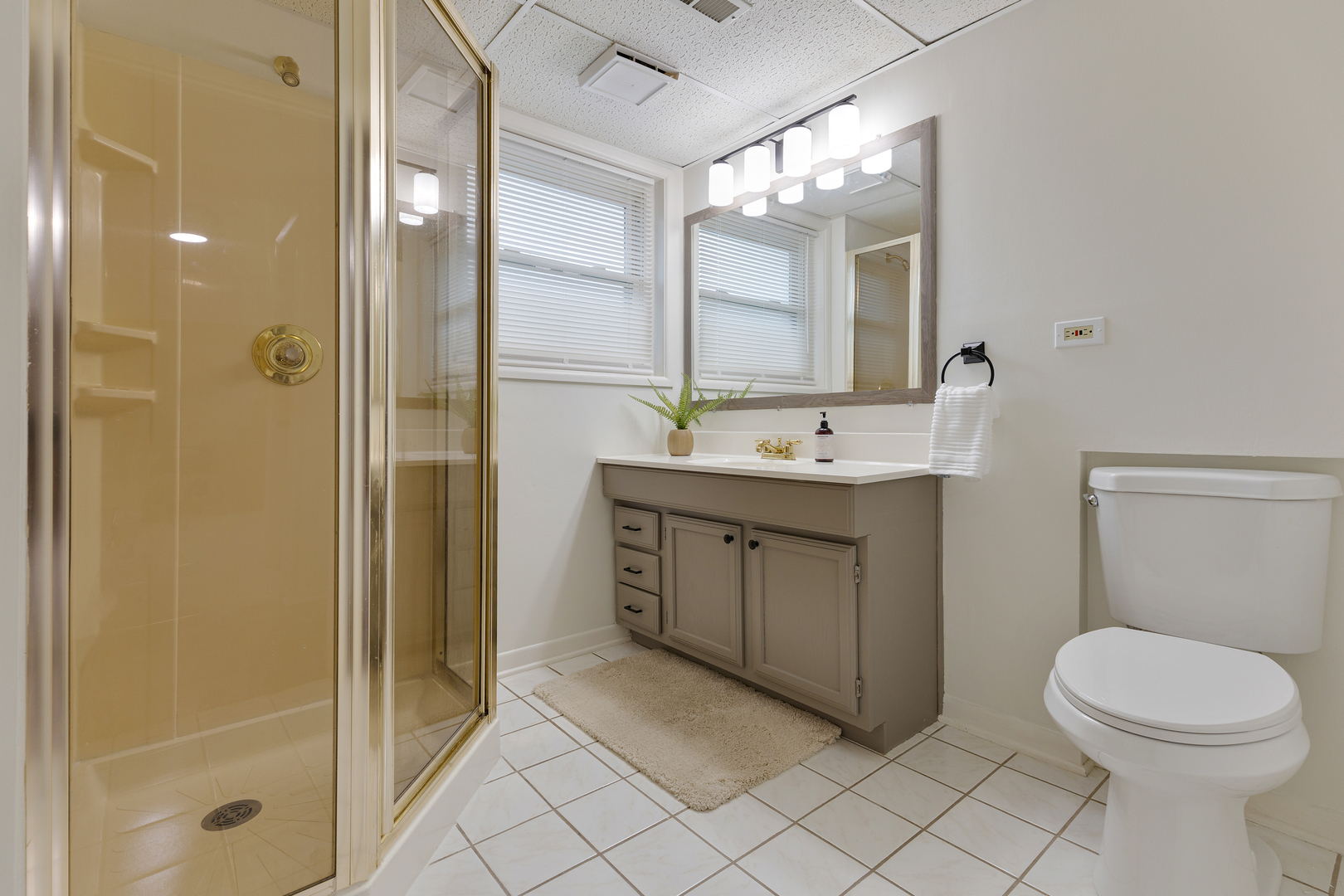 1827 West Sherry Lane Addison, IL 60101 - Photo 22 of 31 a bathroom with a sink a toilet and shower