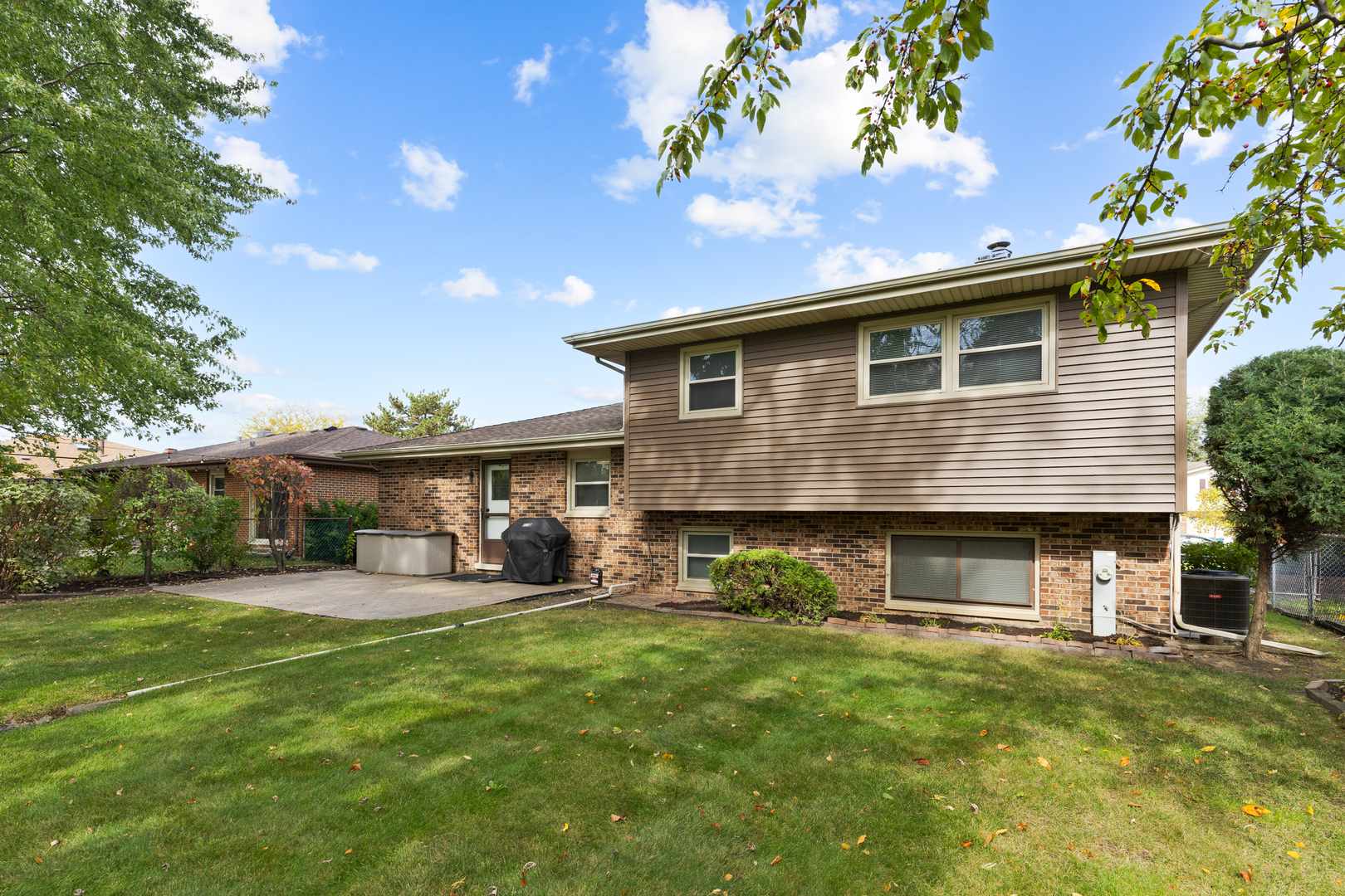 1827 West Sherry Lane Addison, IL 60101 - Photo 24 of 31 a front view of a house with a yard and garage