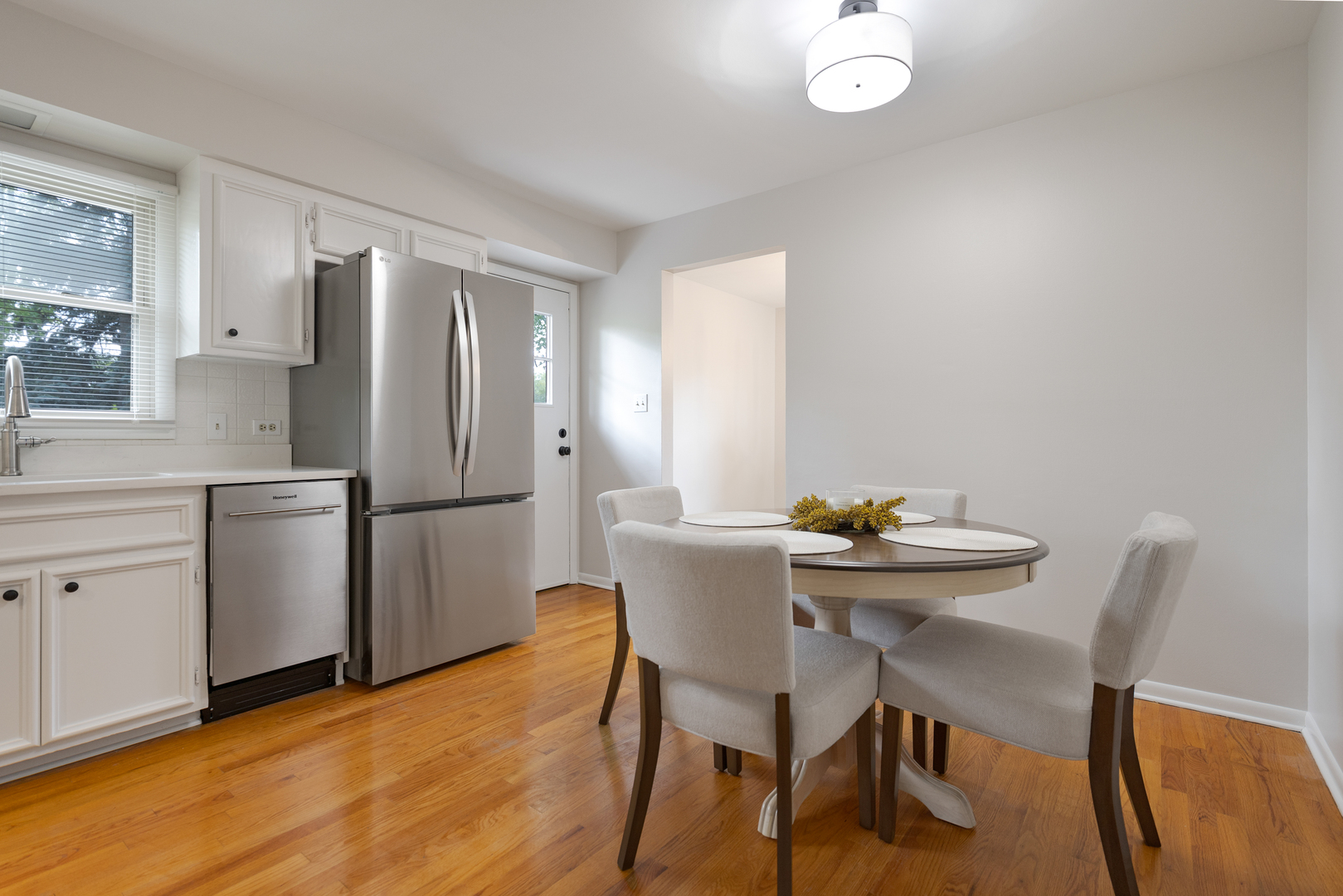 1827 West Sherry Lane Addison, IL 60101 - Photo 8 of 31 a view of a dining room with furniture and wooden floor