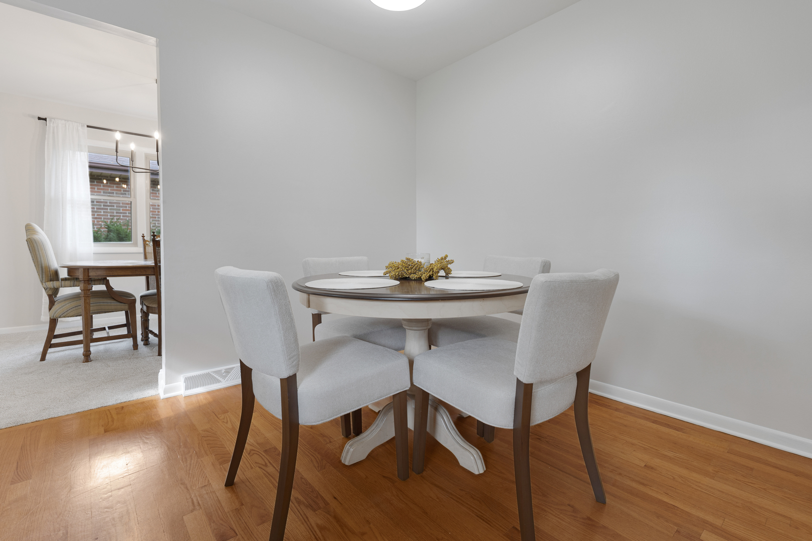 1827 West Sherry Lane Addison, IL 60101 - Photo 9 of 31 a view of a dining room with furniture and wooden floor