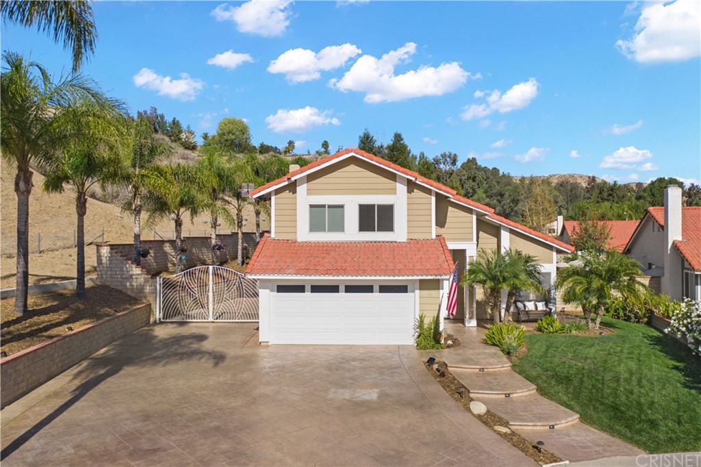 28043 Nantucket Street Castaic, CA 91384 - Photo 2 of 61 a front view of a house with a yard