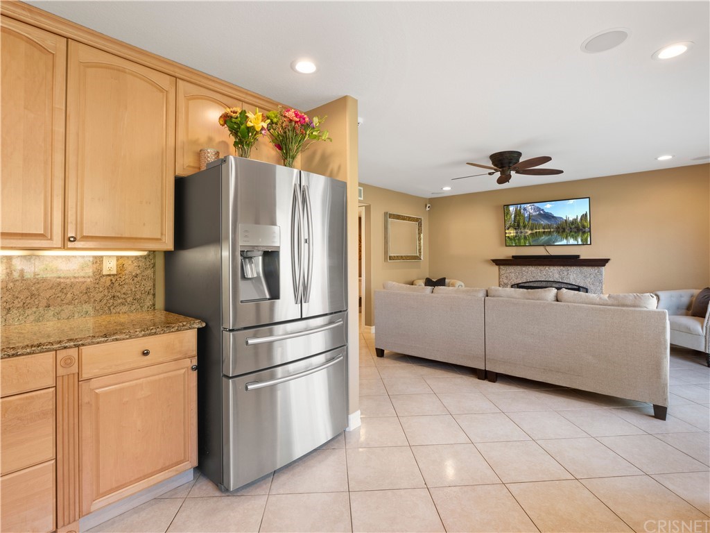 28043 Nantucket Street Castaic, CA 91384 - Photo 15 of 61 a kitchen with stainless steel appliances a refrigerator sink and cabinets
