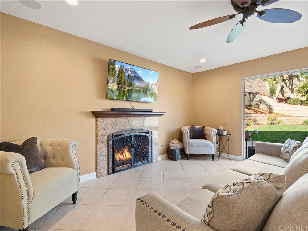 28043 Nantucket Street Castaic, CA 91384 - Photo 19 of 61 a living room with furniture and a fireplace