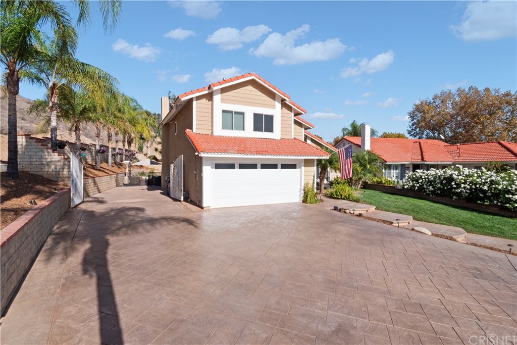 28043 Nantucket Street Castaic, CA 91384 - Photo 3 of 61 a view of a house with a yard and garage
