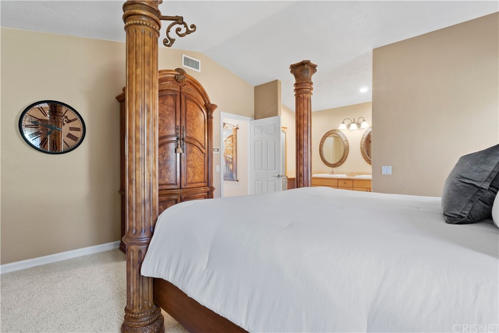 28043 Nantucket Street Castaic, CA 91384 - Photo 25 of 61 a bedroom with a bed and a table in it