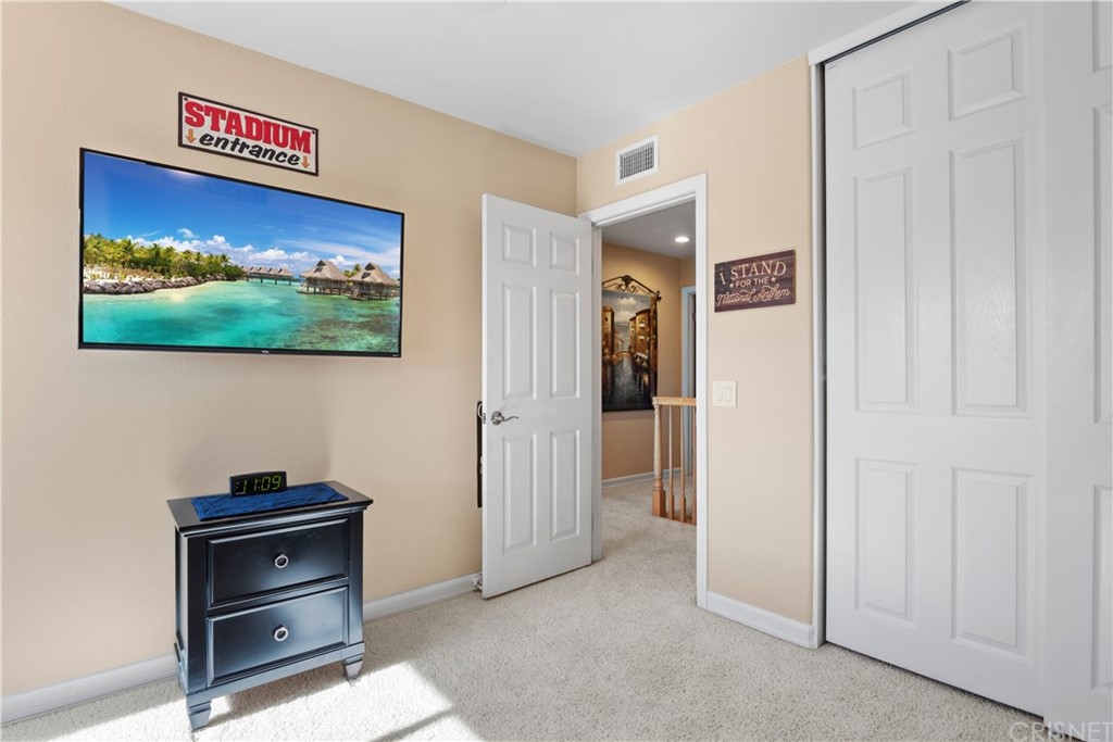 28043 Nantucket Street Castaic, CA 91384 - Photo 30 of 61 a view of a livingroom with a flat screen tv and a dresser