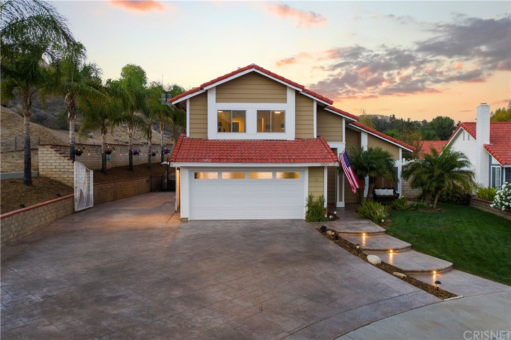 28043 Nantucket Street Castaic, CA 91384 - Photo 60 of 61 a view of a house with a yard and a garden