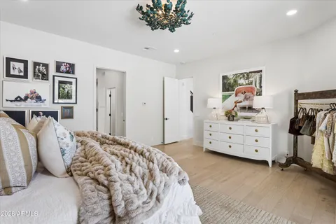 a bedroom with a bed and a dresser