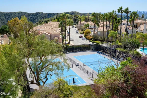 an aerial view of a house with a yard