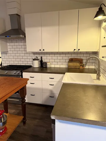 a kitchen with a sink and cabinets