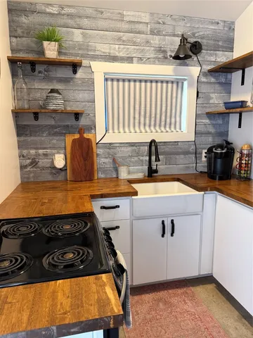 a kitchen with a stove and a cabinet