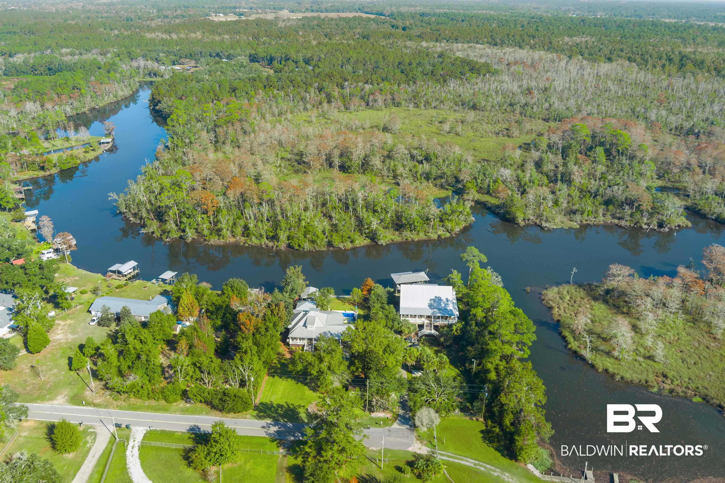 11236 Wren Avenue Fairhope, AL 36532 - Photo 34 of 35 Aerial overview of property's location with a large body of water and a heavily wooded area