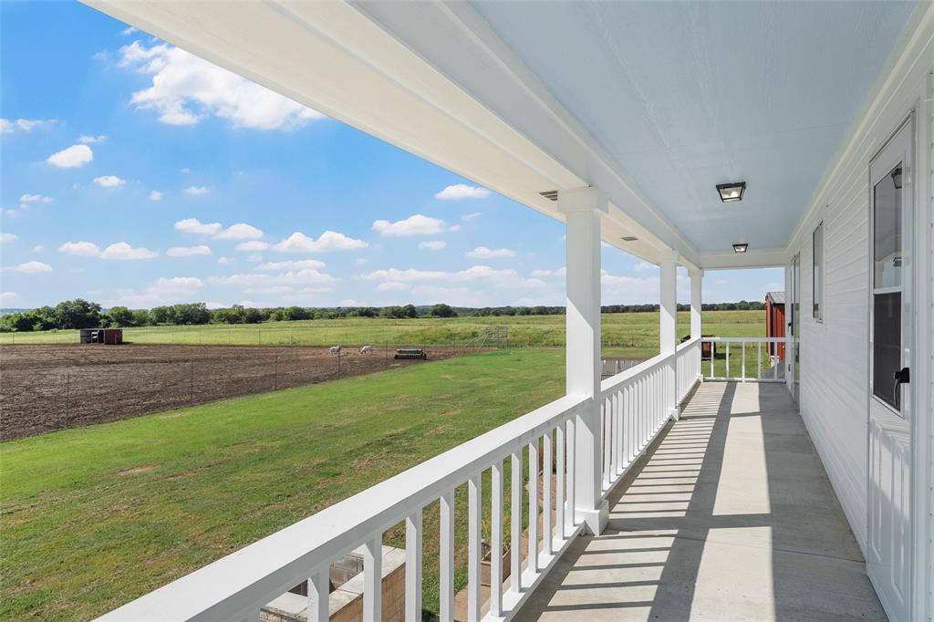 5112 Old Caufield Ranch Road McGregor, TX 76657 - Photo 31 of 39 a view of balcony with city and ocean view