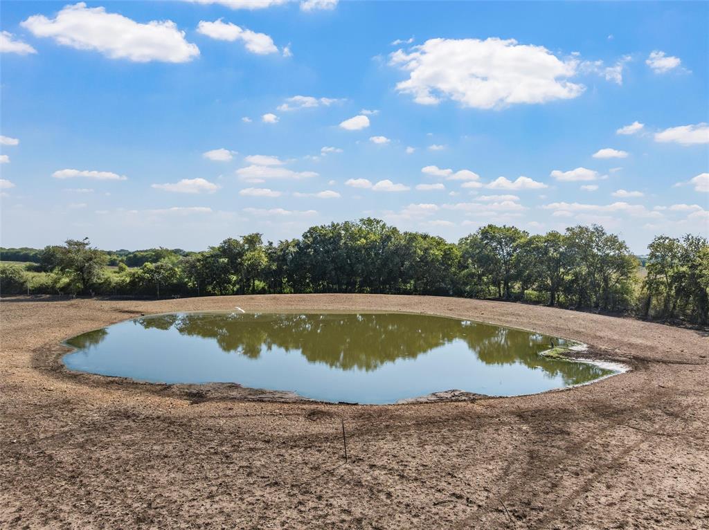 5112 Old Caufield Ranch Road McGregor, TX 76657 - Photo 4 of 39 a view of a swimming pool with a yard
