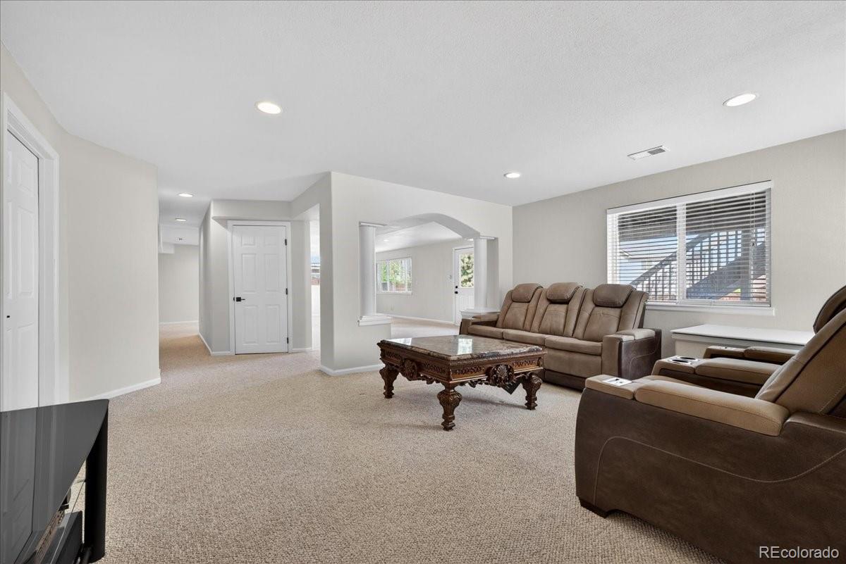 9477 Burgundy Circle Highlands Ranch, CO 80126 - Photo 40 of 50 a living room with furniture and a window