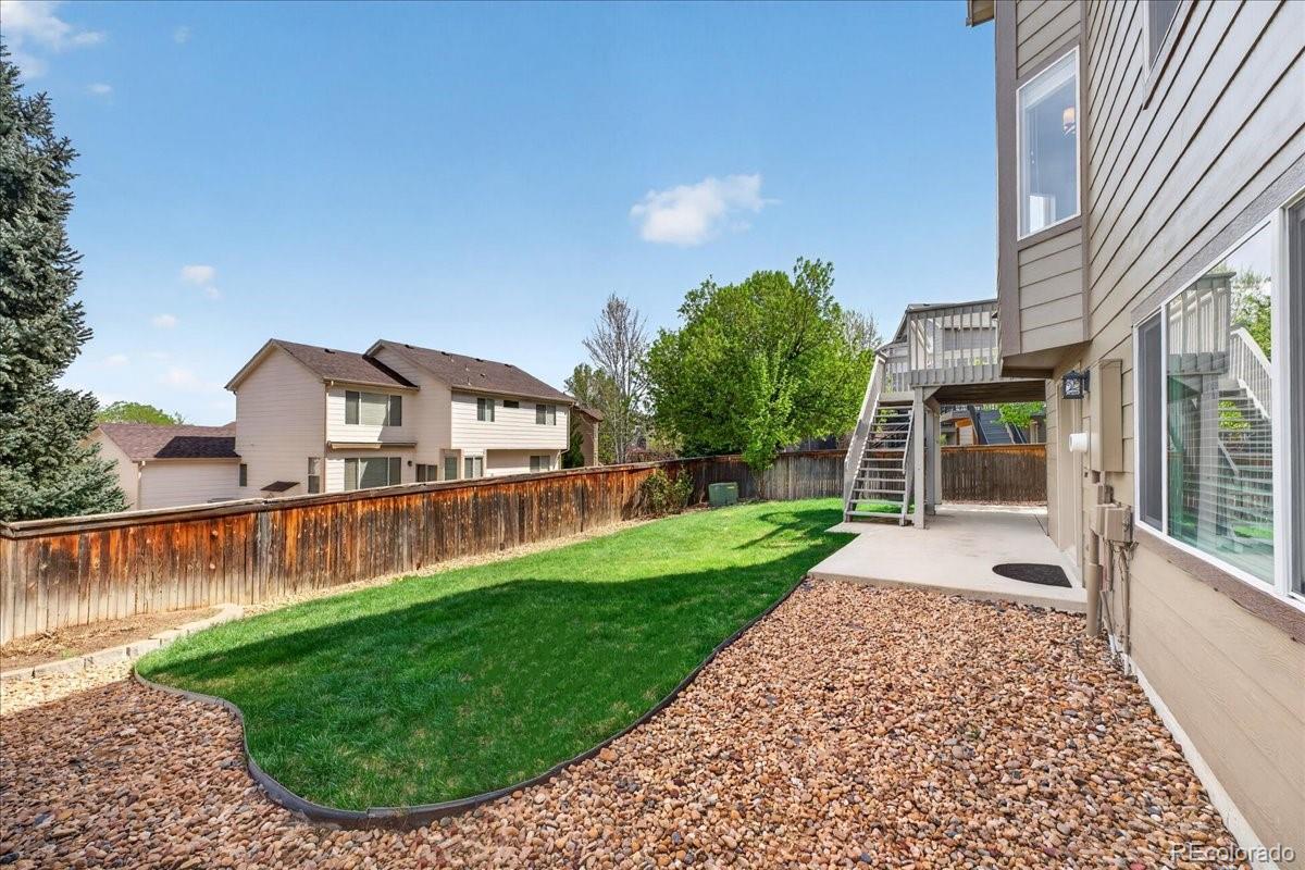 9477 Burgundy Circle Highlands Ranch, CO 80126 - Photo 41 of 50 a view of a house with a yard