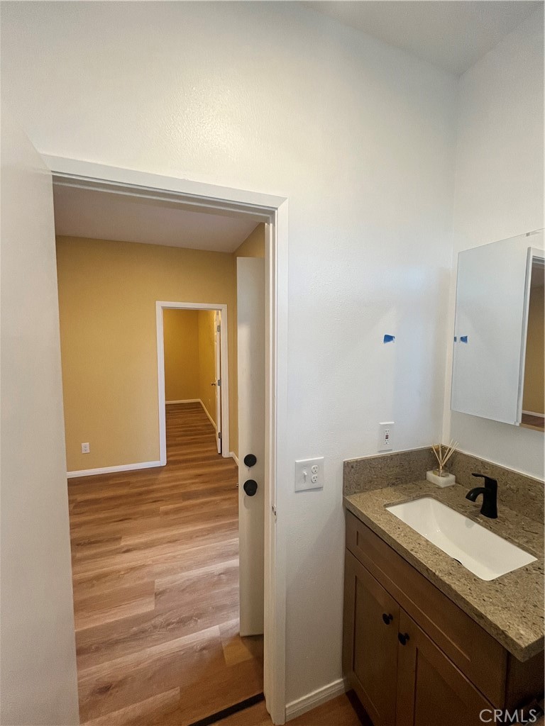 4136 1/2 Eileen Street Riverside, CA 92504 - Photo 2 of 10 a bathroom with a sink and a mirror