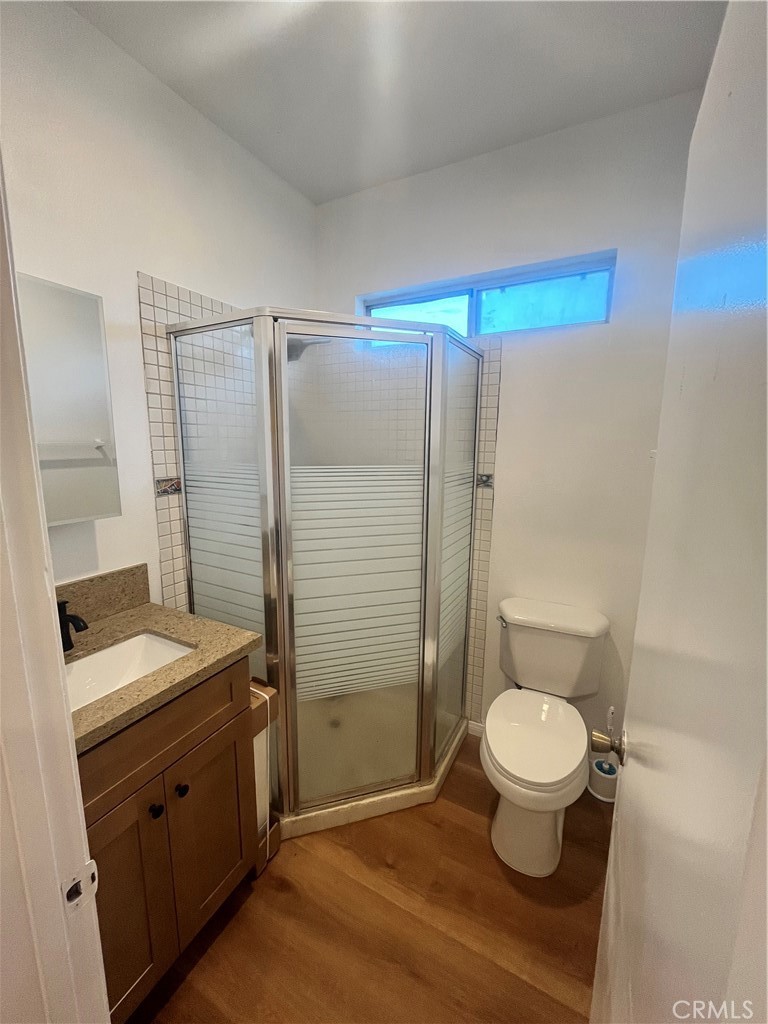 4136 1/2 Eileen Street Riverside, CA 92504 - Photo 3 of 10 a spacious bathroom with a granite countertop sink toilet a mirror and shower