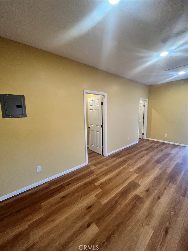 4136 1/2 Eileen Street Riverside, CA 92504 - Photo 4 of 10 a view of empty room with wooden floor