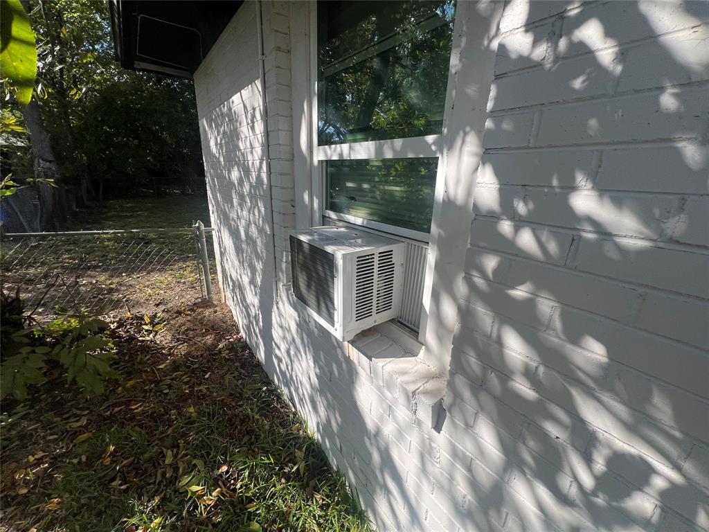 1722 Proctor Street Grand Prairie, TX 75051 - Photo 35 of 39 View of home's exterior with cooling unit