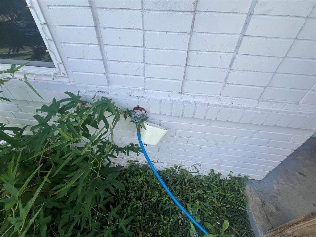 1722 Proctor Street Grand Prairie, TX 75051 - Photo 38 of 39 Exterior view of brick siding