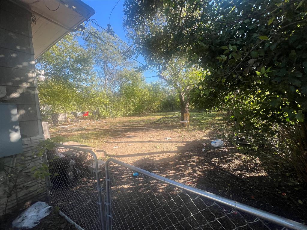 1722 Proctor Street Grand Prairie, TX 75051 - Photo 6 of 39 View of yard with a gate