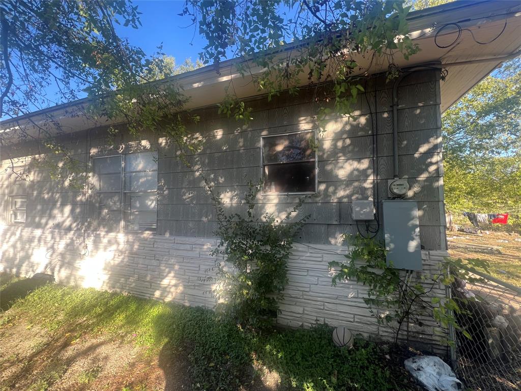 1722 Proctor Street Grand Prairie, TX 75051 - Photo 7 of 39 View of home's exterior with brick siding