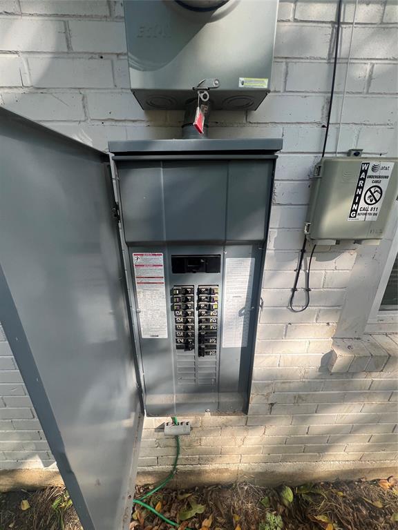 1722 Proctor Street Grand Prairie, TX 75051 - Photo 9 of 39 Exterior view of electric meter and electric panel
