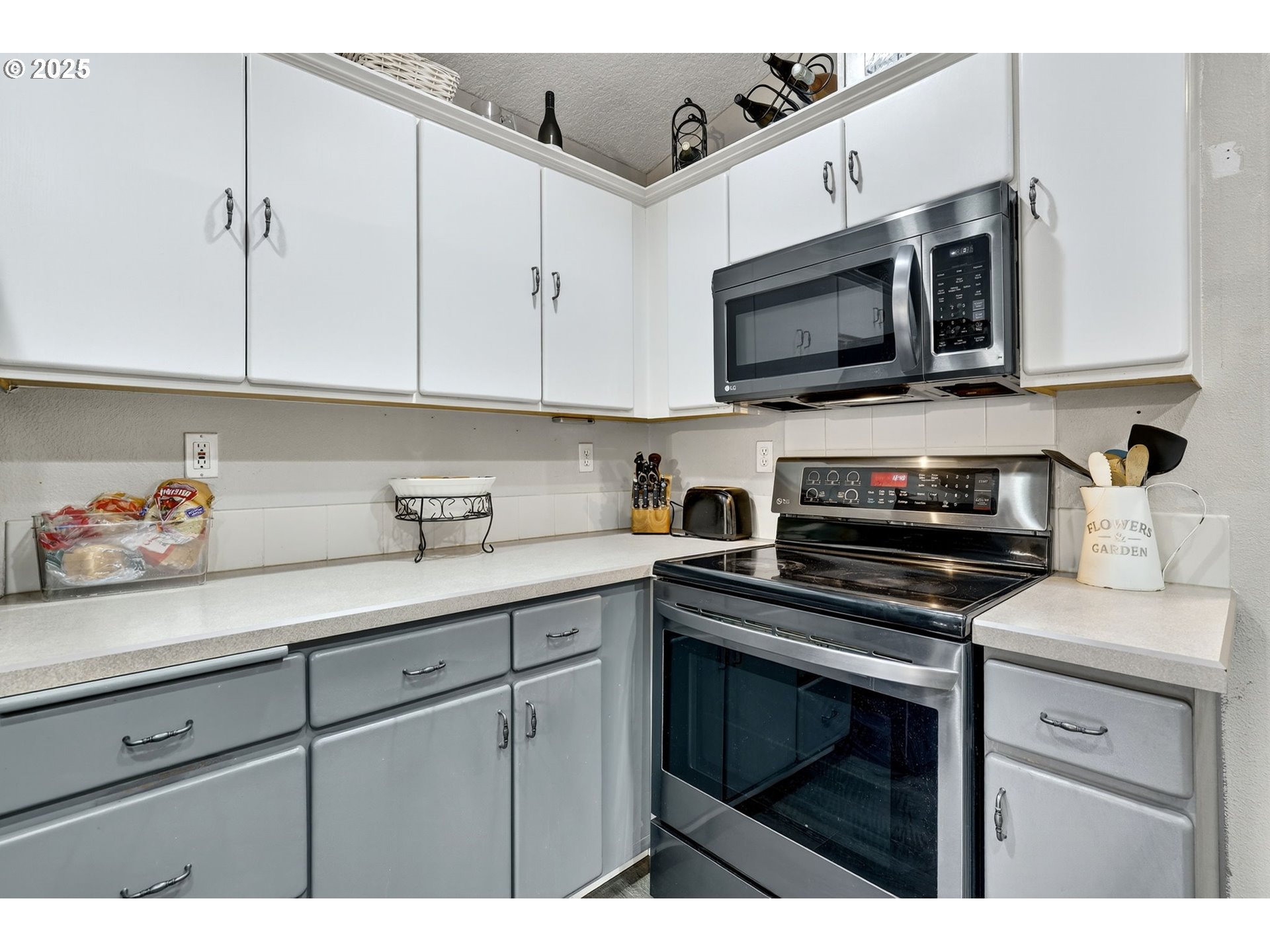 3915 Southeast 14th Street Gresham, OR 97080 - Photo 16 of 46 a kitchen with stainless steel appliances granite countertop a sink a stove and microwave