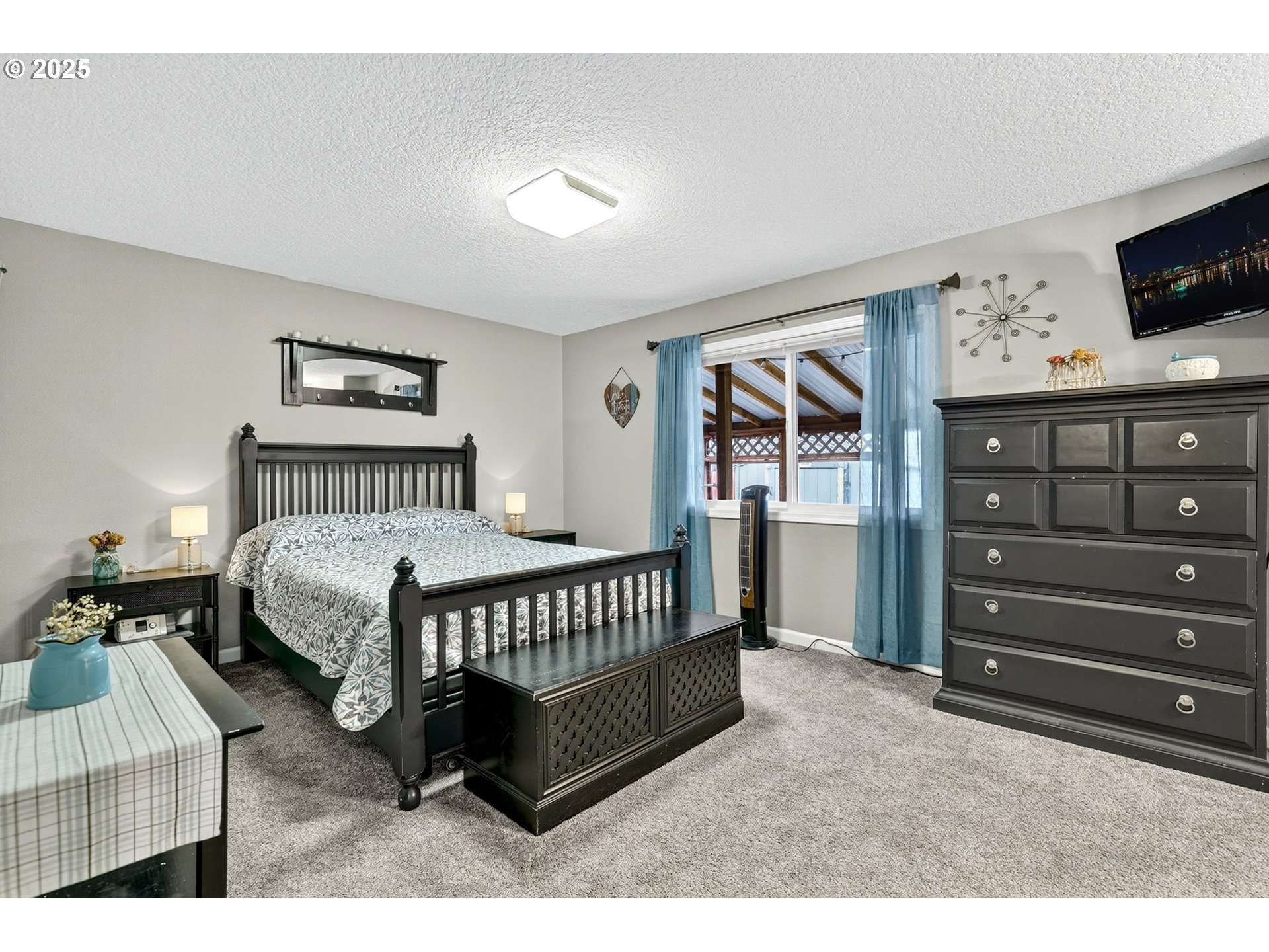 3915 Southeast 14th Street Gresham, OR 97080 - Photo 18 of 46 a bedroom with a bed window and a night stand