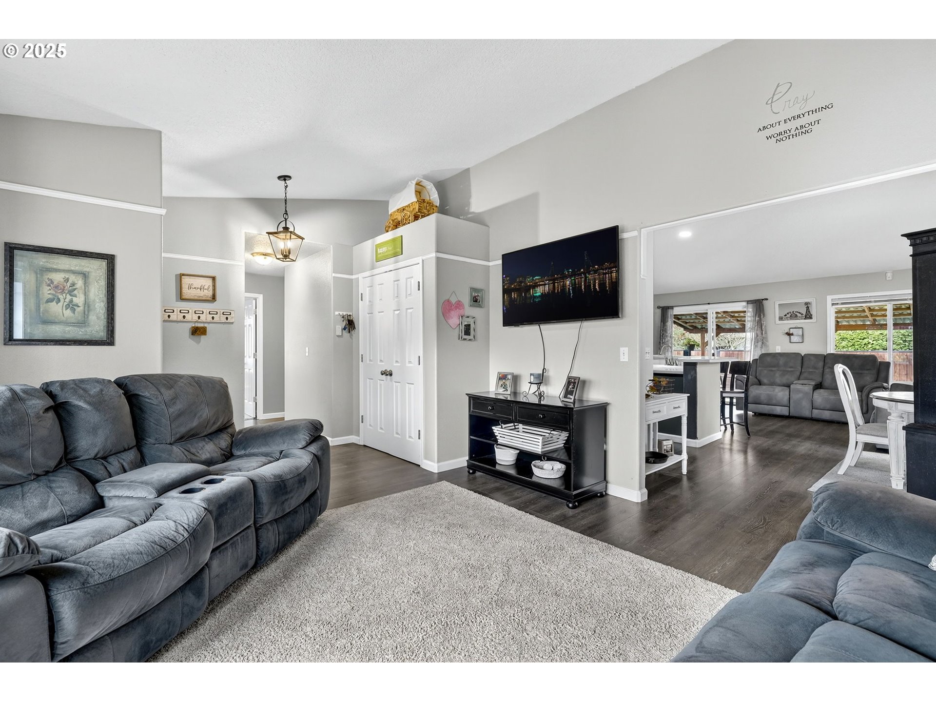 3915 Southeast 14th Street Gresham, OR 97080 - Photo 2 of 46 a living room with furniture flat screen tv and a fireplace